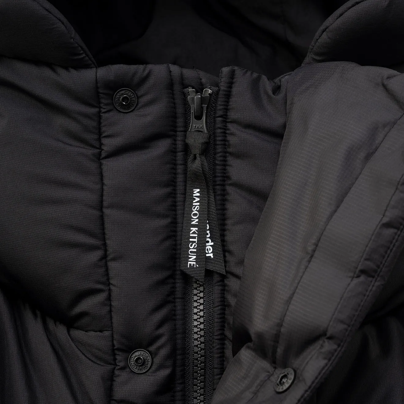 And Wander x Maison Kitsune Isolationsjacke Schwarz