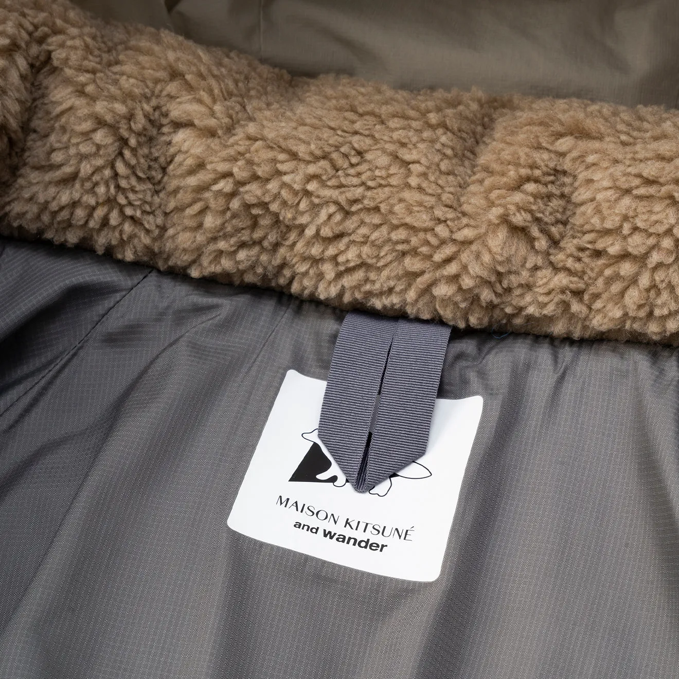 And Wander x Maison Kitsune Nordic Border Isolationsjacke Beige